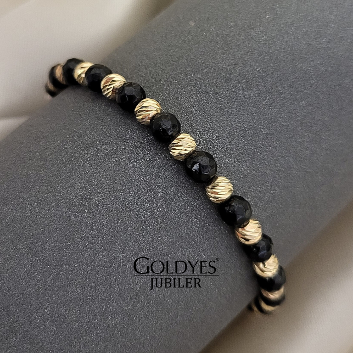 złota bransoletka na czarnym sznureczku z diamentowanymi kulkami próba złota 585