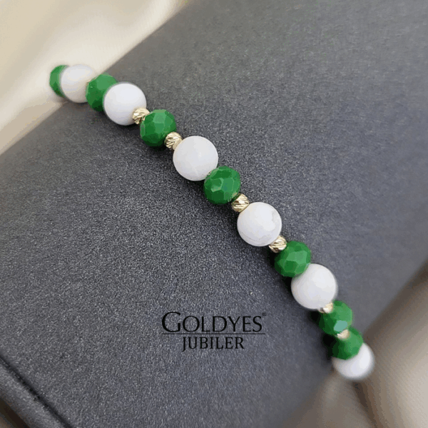 złota bransoletka na czarnym sznureczku z diamentowanymi kulkami próba złota 585